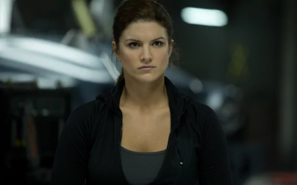Riley Hicks, portrayed by Gina Carano in Fast & Furious 6, stands confidently in a dramatic moment, captured in this high-definition desktop wallpaper.