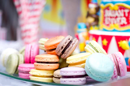HD desktop wallpaper featuring a colorful assortment of macaron biscuits arranged as a vibrant dessert display.
