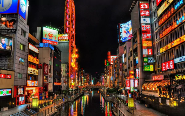 A vibrant night scene of Osaka's canal, illuminated by colorful city lights and neon signs, showcasing the dynamic urban landscape of Japan in stunning HDR quality.