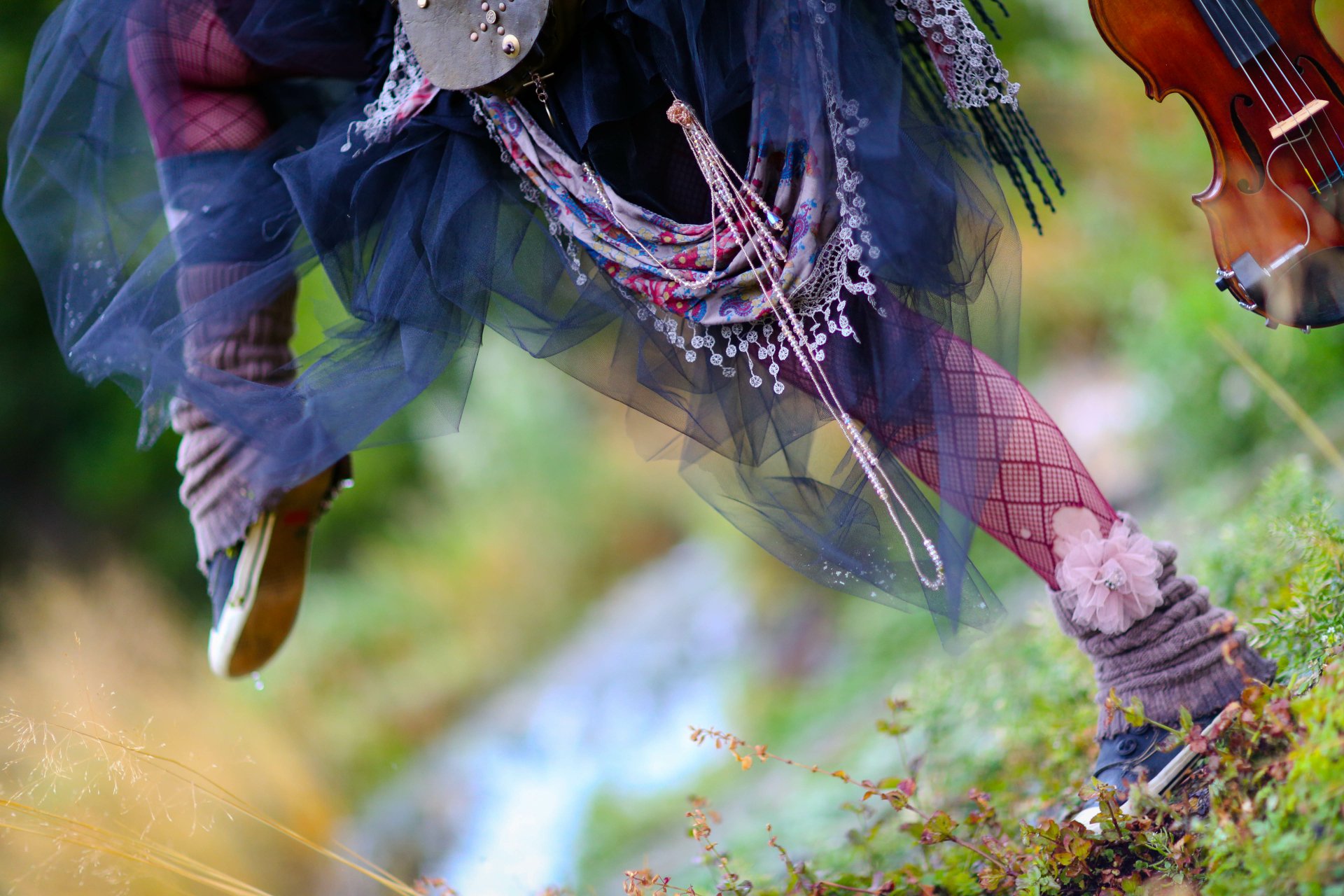 Close-up of a dynamic scene featuring Lindsey Stirling’s flowing outfit and violin, captured in vibrant 4K Ultra HD for a striking PC desktop wallpaper.