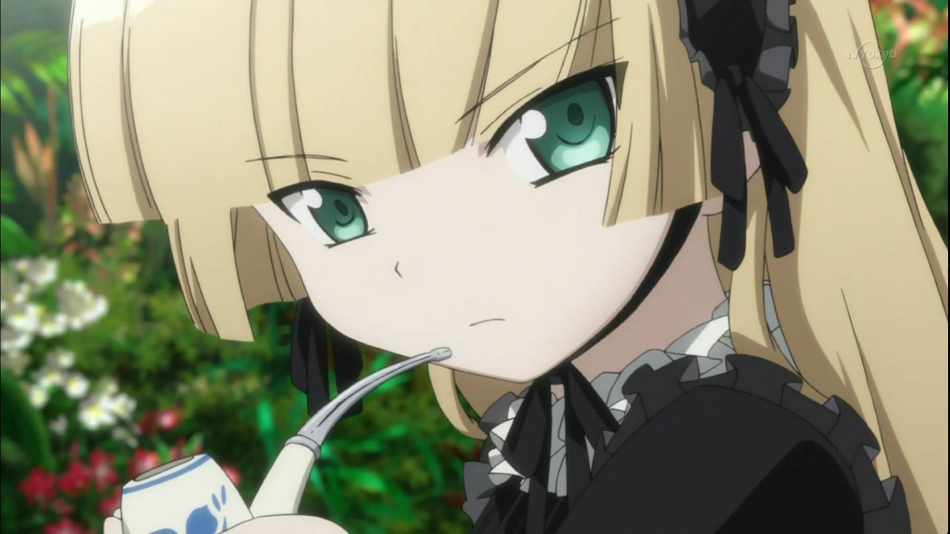 HD anime wallpaper featuring Victorique de Blois from Gosick, with her distinctive green eyes and blonde hair, holding a pipe against a blurred outdoor background.