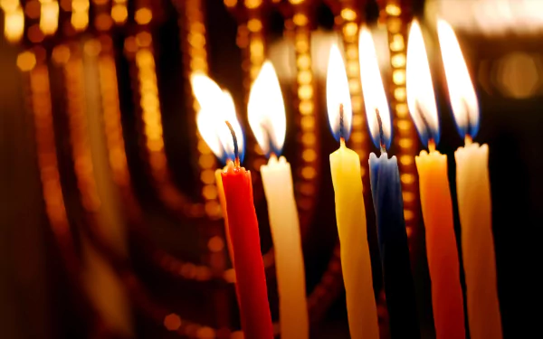 Close-up of brightly lit Hanukkah candles glowing warmly, captured in stunning 4K Ultra HD for a vibrant holiday PC desktop wallpaper.