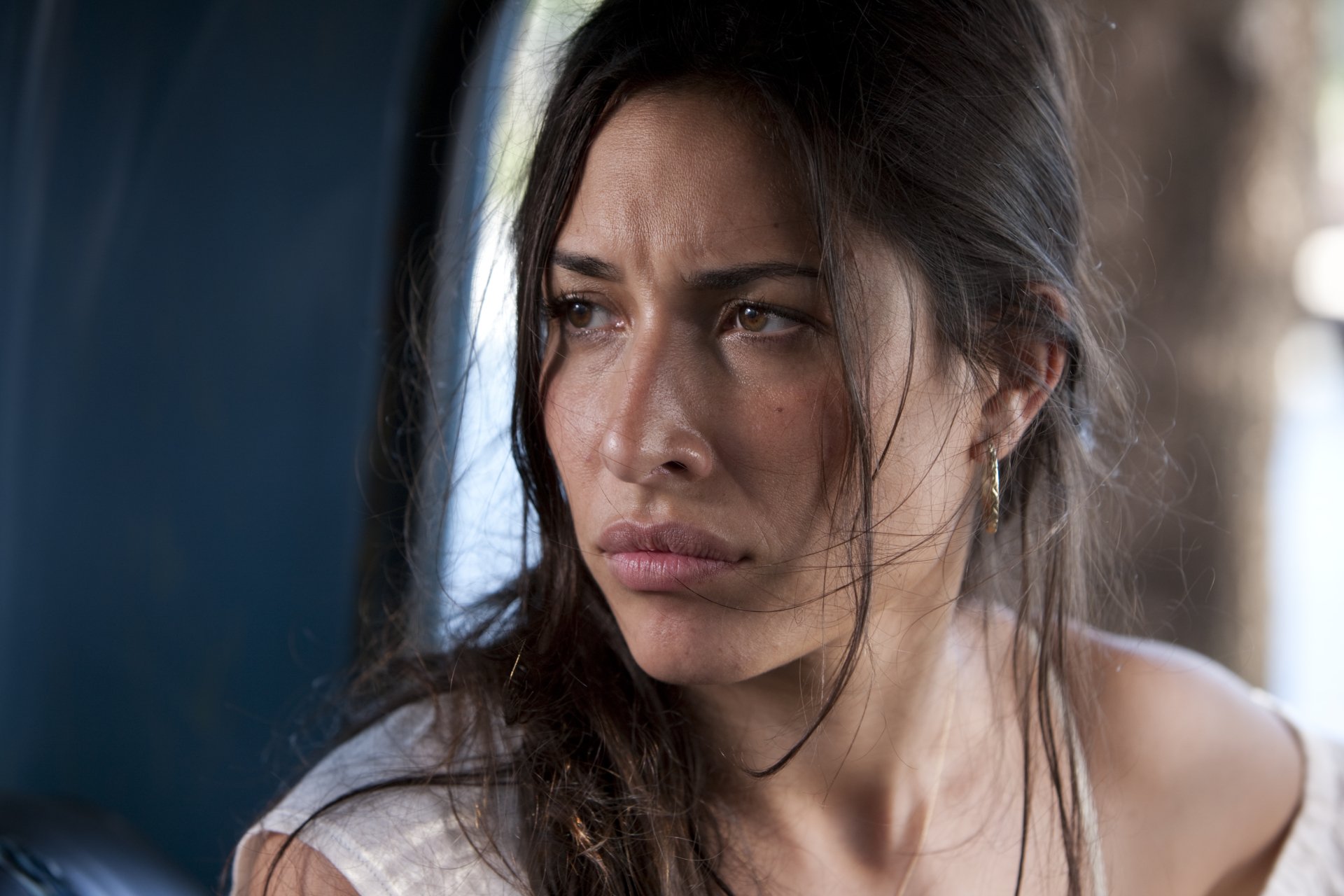 Close-up of a young woman with intense expression, from the movie *The Expendables*. This image serves as a cinematic 4K Ultra HD desktop wallpaper.