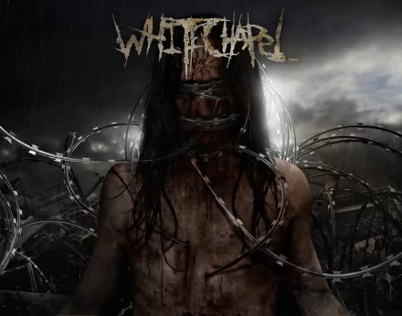 HD desktop wallpaper featuring a dark, intense scene with a figure entangled in barbed wire, representing the music band Whitechapel.