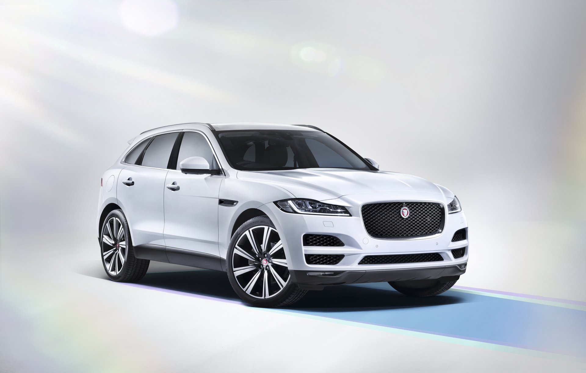 White Jaguar F-PACE SUV displayed as a sleek 4K Ultra HD desktop wallpaper, showcasing the luxury vehicle in a bright, minimalist setting.