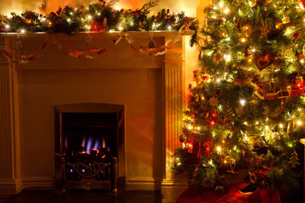 HD PC desktop wallpaper of a cozy room with a lit fireplace, decorated garland, twinkling Christmas lights and ornaments on a glowing Christmas tree.