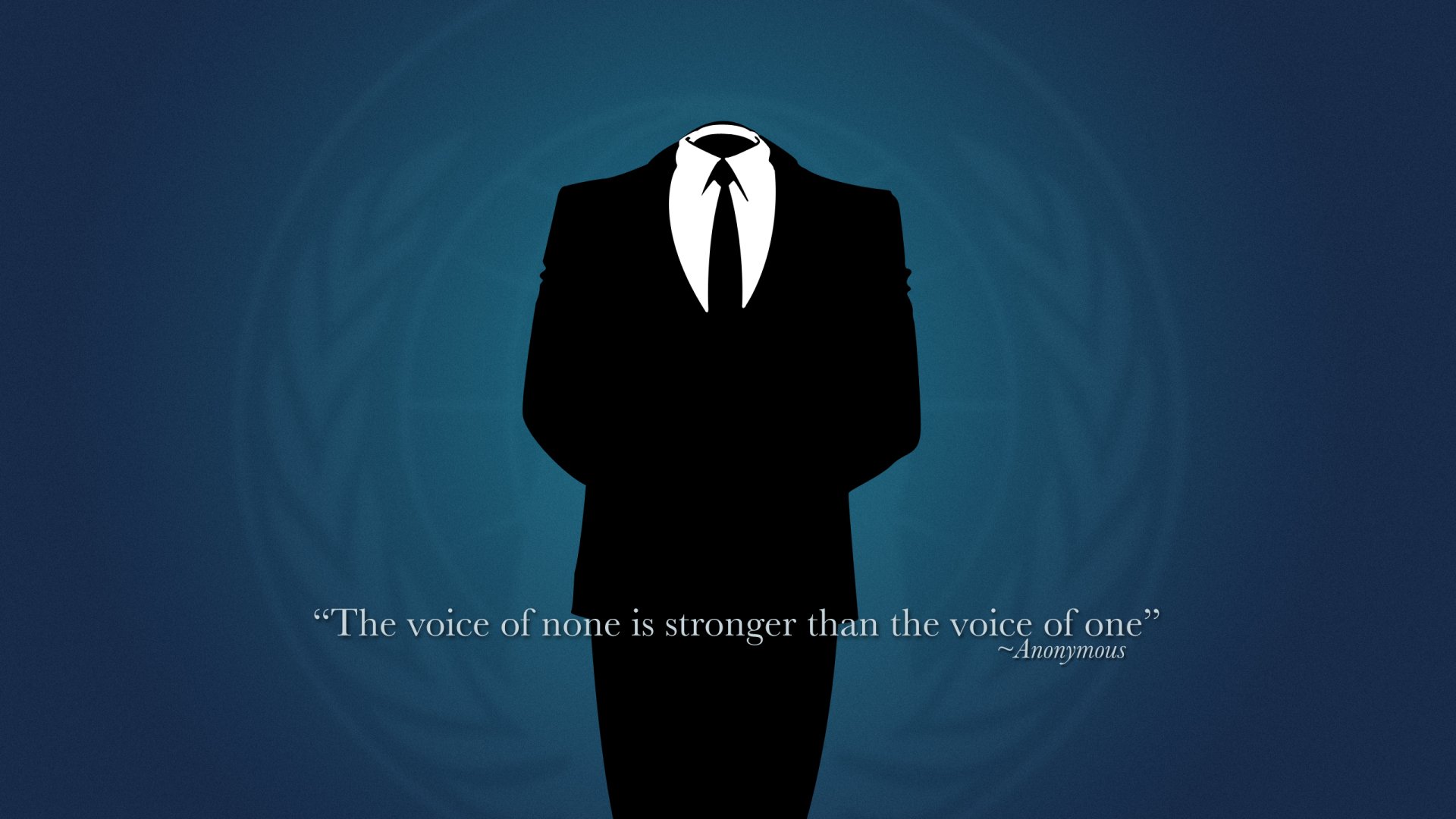 A sleek HD desktop wallpaper featuring an anonymous figure in a suit against a dark blue background, with the quote, The voice of none is stronger than the voice of one.