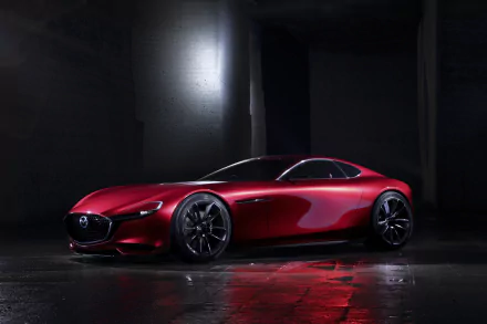 Sleek red Mazda RX-Vision concept car showcased in a dark setting, captured in 4K Ultra HD as a stylish PC desktop wallpaper and background.