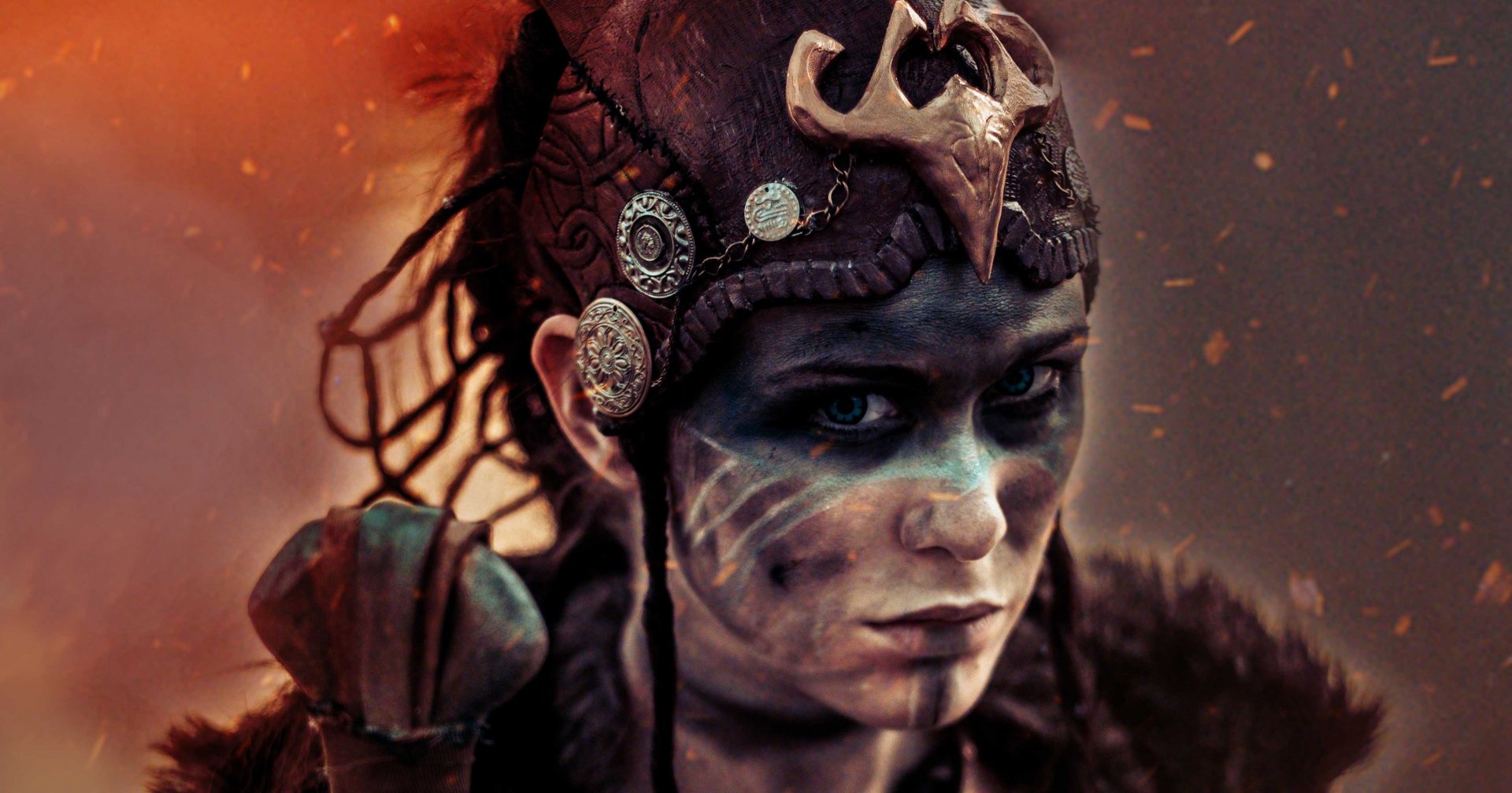 HD PC desktop wallpaper featuring Senua from the video game Hellblade: Senua's Sacrifice, showcasing her intense gaze and detailed tribal face paint.