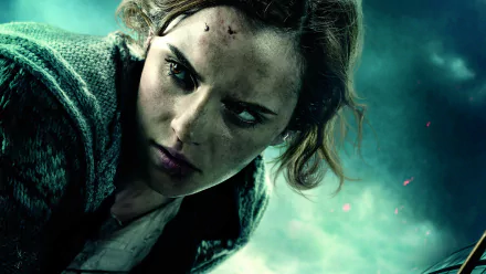 Hermione Granger, portrayed by Emma Watson, is featured in this HD wallpaper from *Harry Potter and the Deathly Hallows: Part 1*, showcasing her determined expression and resilience.