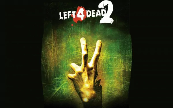 A HD desktop wallpaper featuring the iconic hand gesture from the video game Left 4 Dead 2, set against a textured green and black background.