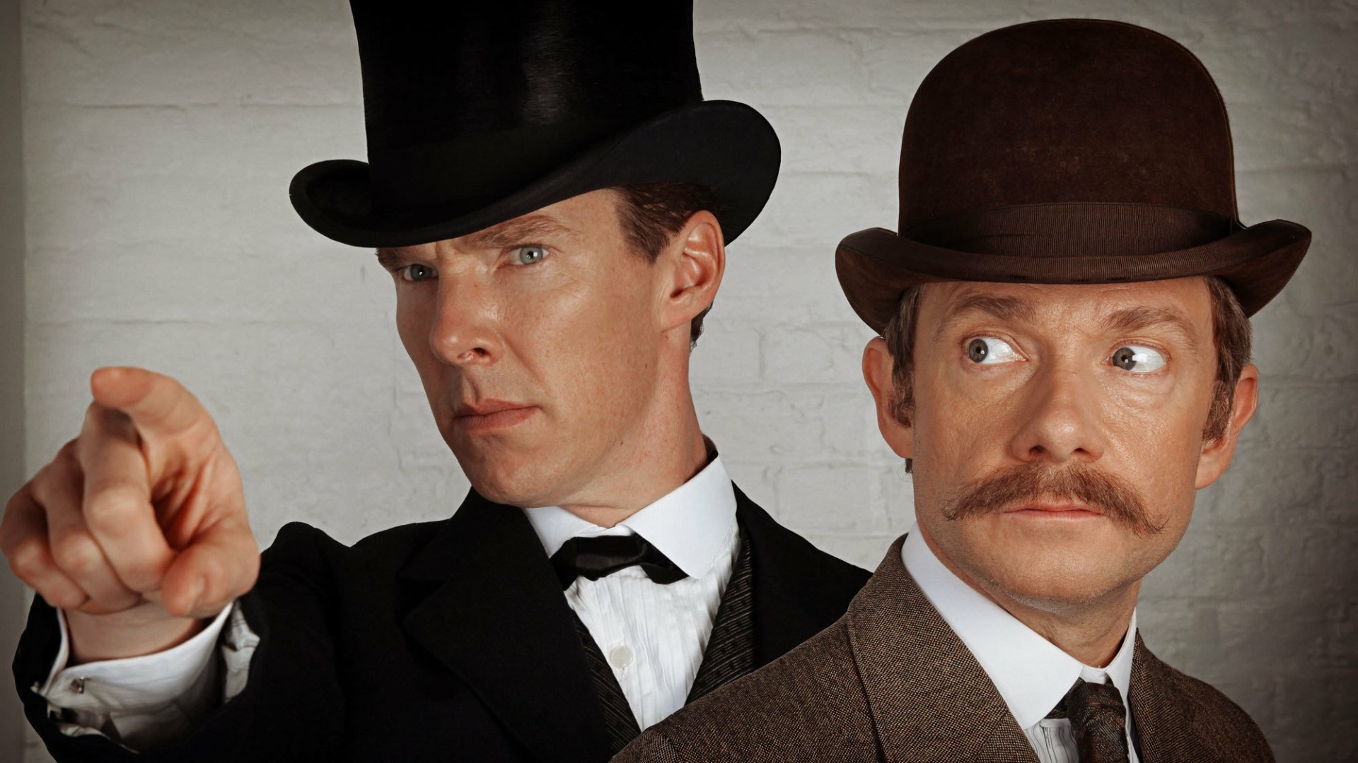 HD PC desktop wallpaper featuring Benedict Cumberbatch and Martin Freeman in Victorian attire from the TV show Sherlock.