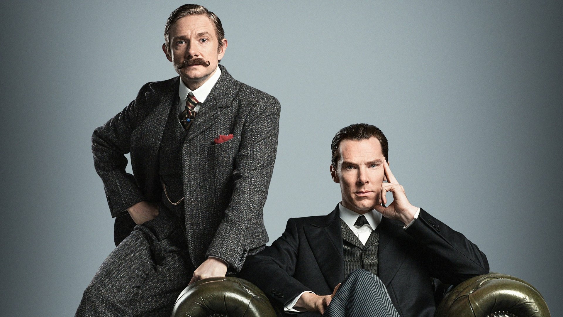 Benedict Cumberbatch and Martin Freeman, as Sherlock Holmes and Dr. John Watson, pose in a stylistic HD wallpaper from the acclaimed TV series Sherlock.