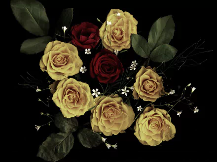 HD desktop wallpaper featuring a bouquet of vibrant red and yellow roses with green leaves and delicate white accents against a dark background.