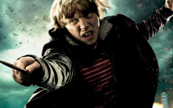 HD PC desktop wallpaper from the movie Harry Potter and the Deathly Hallows: Part 2, featuring Ron Weasley casting a spell in an intense scene.