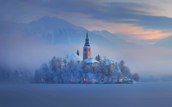 HD desktop wallpaper of a serene church on a snowy island at dawn, surrounded by mist and soft pastel skies, creating a peaceful religious atmosphere.
