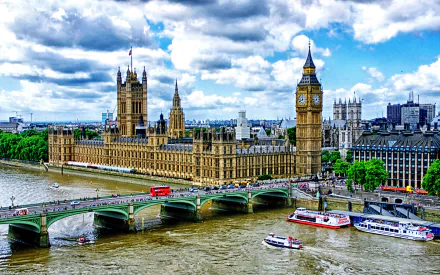 A stunning cityscape featuring the Palace of Westminster and Big Ben, with boats on the River Thames and a vibrant bridge connecting the iconic structures under a cloudy sky.