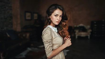 HD desktop wallpaper featuring a brunette woman with brown eyes, styled as a model, against a bokeh background.