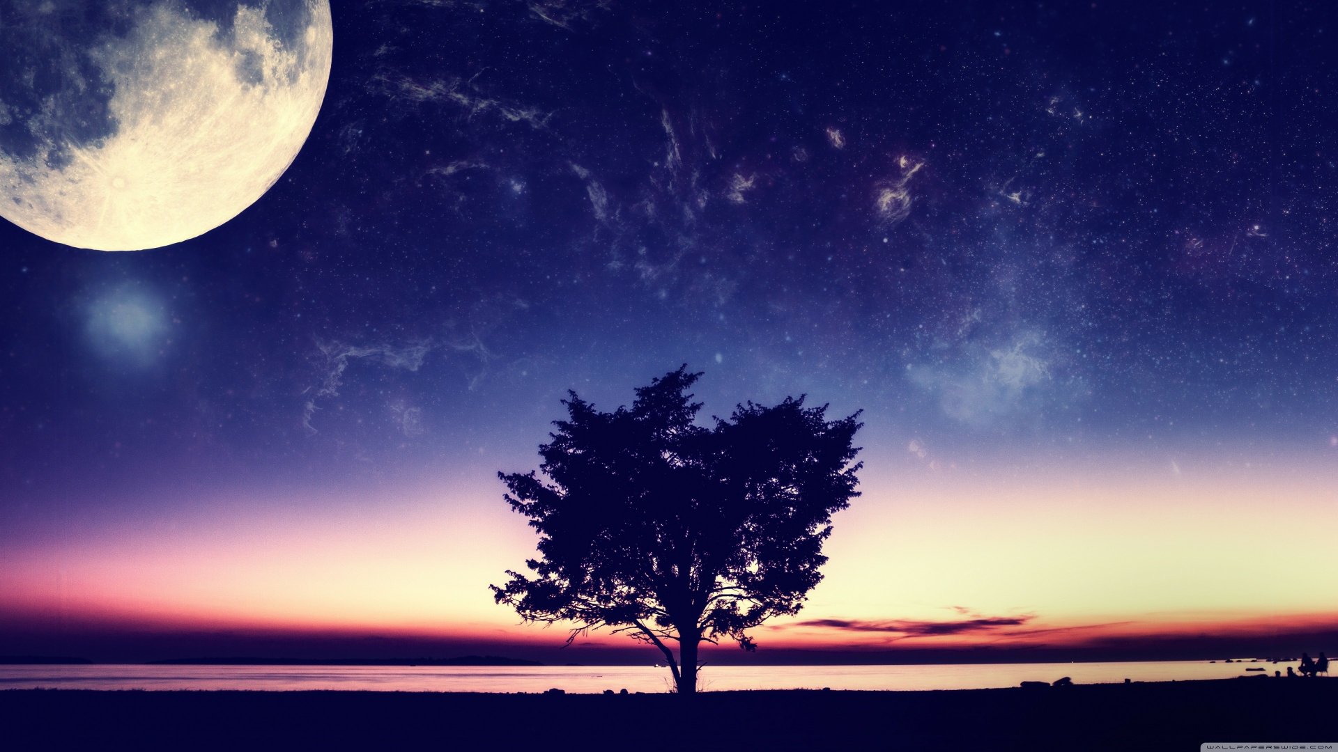 A dreamy landscape featuring a silhouette of a tree against a vibrant night sky, with a large moon and stars illuminating the ocean below, capturing a fantasy-like atmosphere.