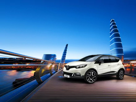 White Renault Captur SUV showcased on a modern city bridge with futuristic light trails, presented as an HD PC desktop wallpaper and background.