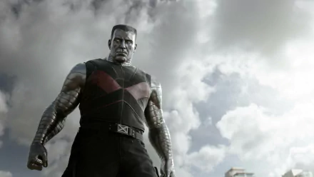 HD desktop wallpaper featuring Colossus from the Deadpool movie, showcasing the character's imposing presence against a dramatic cloudy sky.