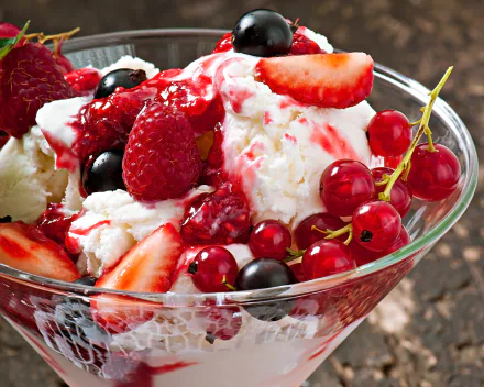 A vibrant 4K Ultra HD wallpaper featuring a glass bowl of ice cream topped with fresh currants, raspberries, strawberries, and sweet syrup.