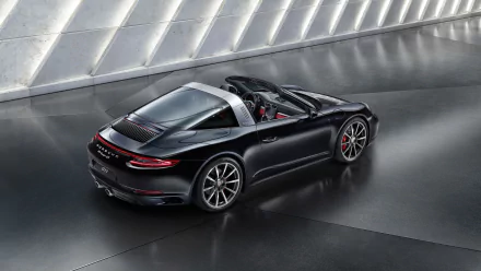 HD desktop wallpaper of a sleek black Porsche 911 Targa, showcasing its elegant design and sporty profile in a modern, well-lit setting.