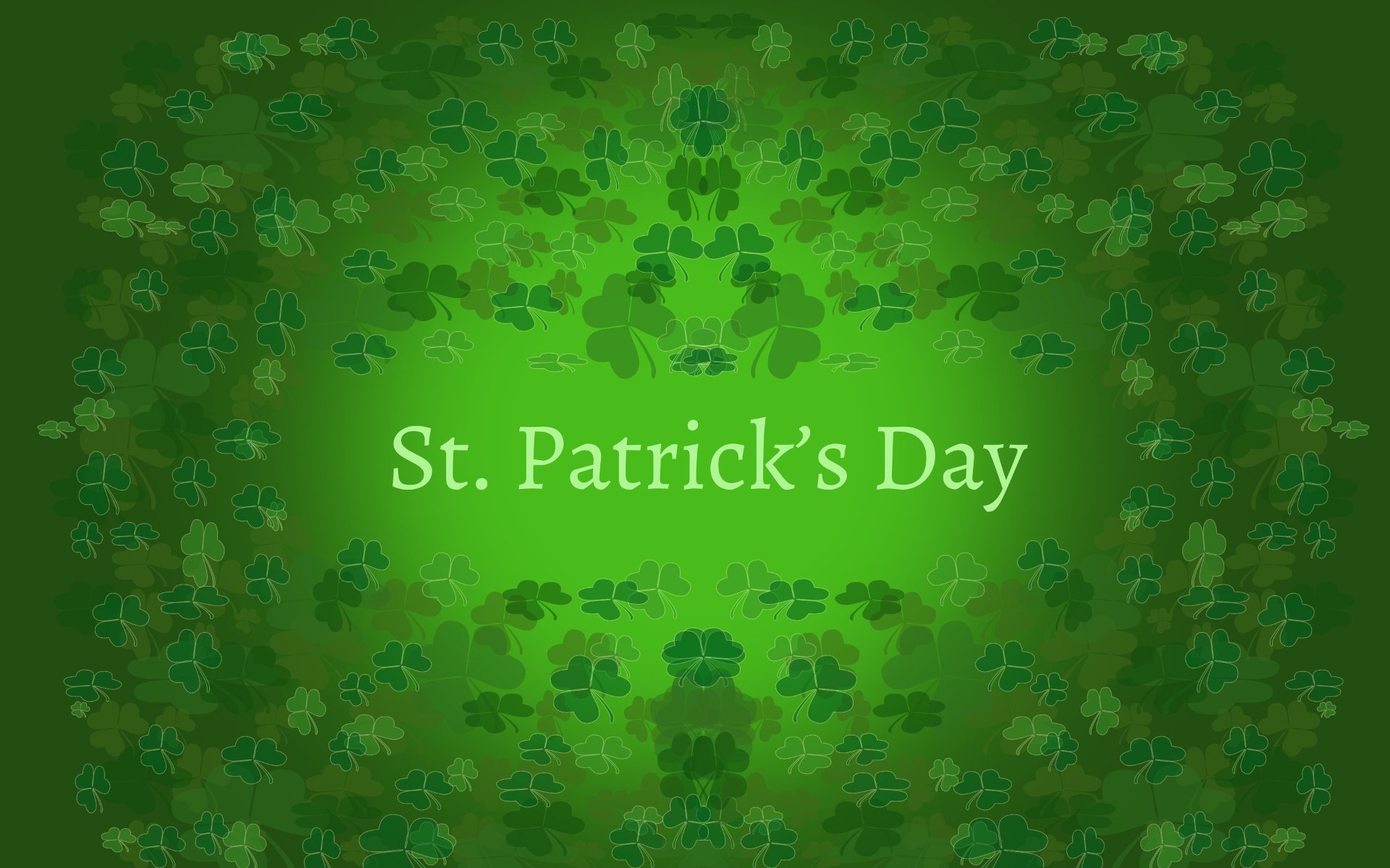 HD desktop wallpaper featuring green clovers surrounding the text St. Patrick's Day on a gradient green background, celebrating the holiday.
