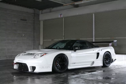 A sleek white JDM vehicle with custom modifications is showcased against a concrete backdrop, creating a striking HD desktop wallpaper and background.