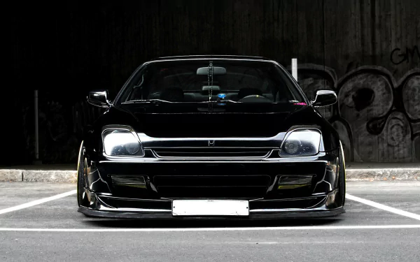 A sleek black JDM vehicle captured in an underground setting, showcasing its striking design. This HD desktop wallpaper offers a stylish backdrop for automotive enthusiasts.