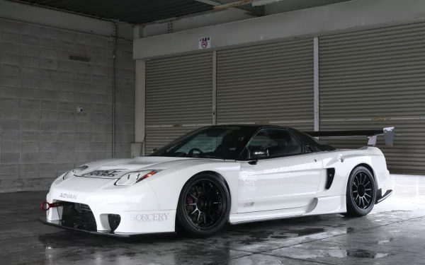 A sleek white JDM vehicle with custom modifications is showcased against a concrete backdrop, creating a striking HD desktop wallpaper and background.