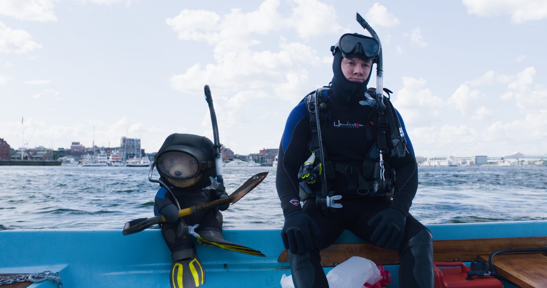 Ted (movie character) from Ted 2 sits in scuba gear beside his on-screen partner on a boat at sea — 4K Ultra HD PC desktop wallpaper.