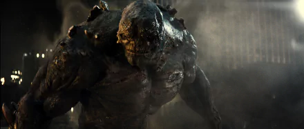 Doomsday, the fearsome creature from DC Comics, towers menacingly in a scene from *Batman V Superman: Dawn Of Justice*, presented as a high-definition desktop wallpaper.