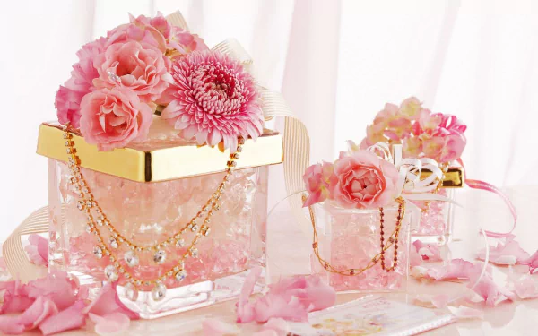 HD desktop wallpaper featuring pink chrysanthemum and rose petals arranged in glass containers adorned with gold and diamond jewelry in a delicate still life composition.