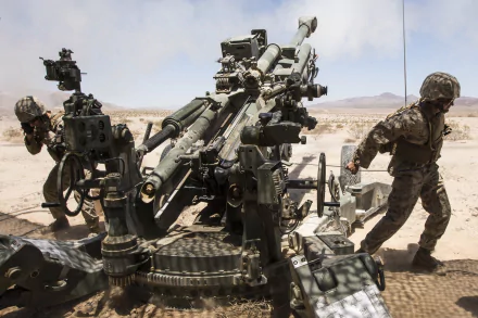 HD desktop wallpaper featuring soldiers operating heavy artillery in a desert military setting, highlighting weaponry and tactical action.