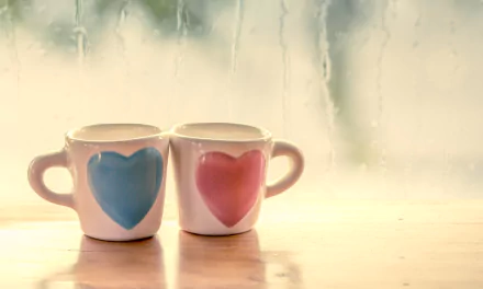 HD wallpaper of two cups with heart shapes, symbolizing love and romance, against a misty window background.