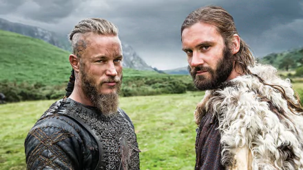 Rollo and Ragnar Lothbrok from the TV show Vikings (2013), featuring Clive Standen as Rollo and Travis Fimmel as Ragnar, against a dramatic landscape backdrop. HD wallpaper.