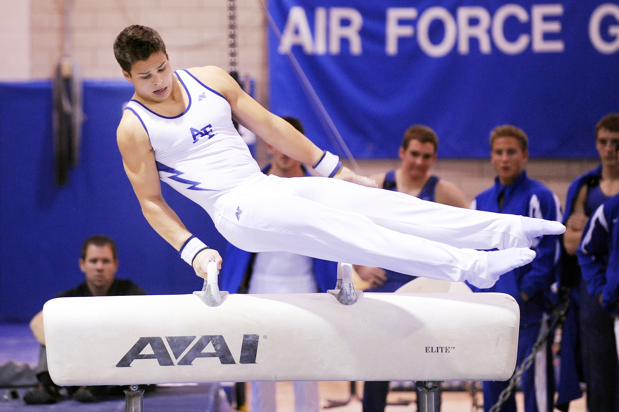 Male gymnasts from the air force on the pommel horse by skeeze