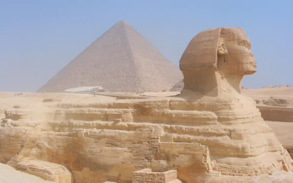 2K Quad HD PC desktop wallpaper showing the Sphinx and a Giza pyramid in Egypt — Egyptian, man-made monuments under a clear blue sky.