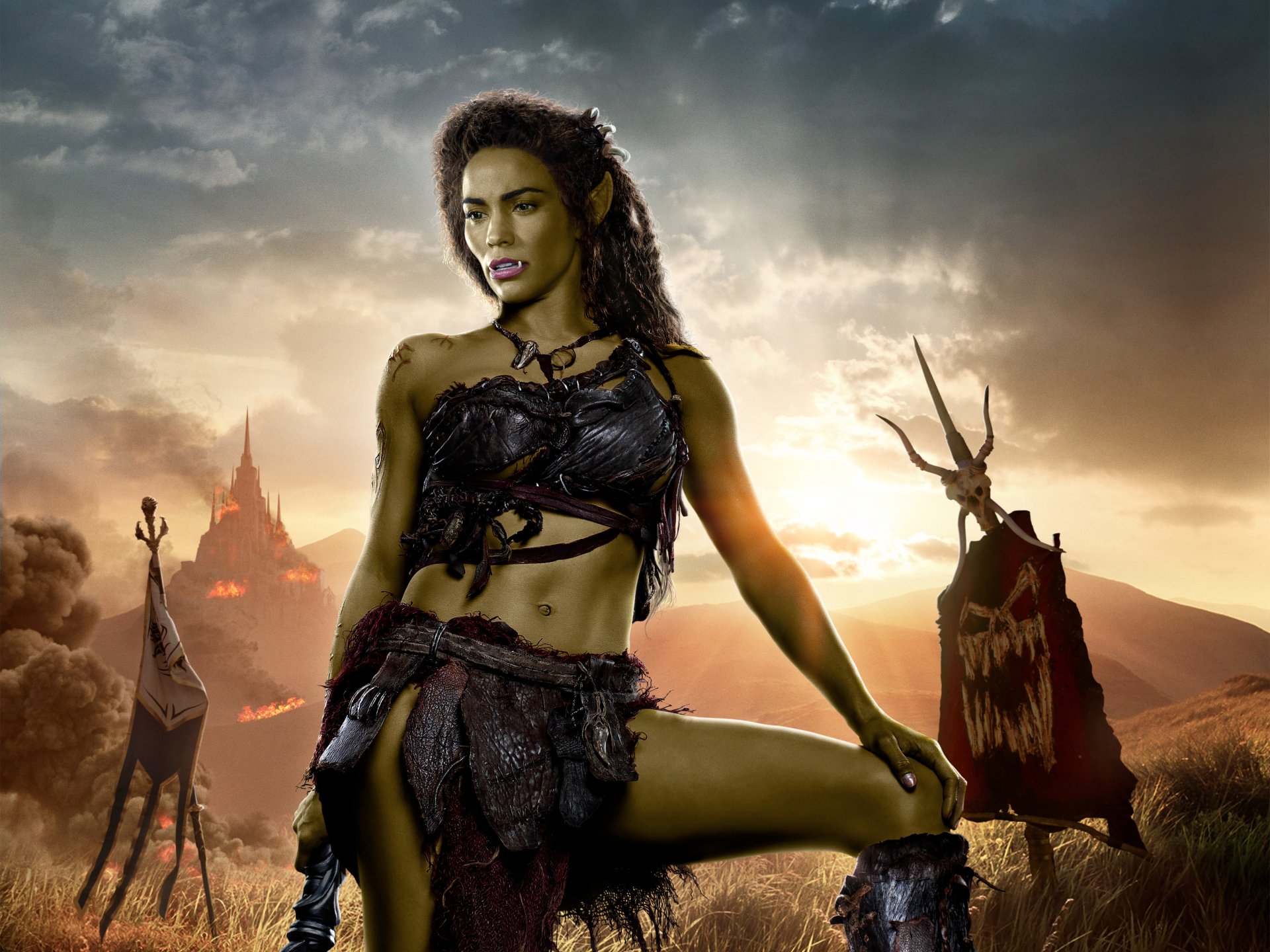 4K Ultra HD Warcraft movie wallpaper featuring a fierce female orc warrior in tribal armor against a dramatic, smoky battlefield backdrop with war banners.