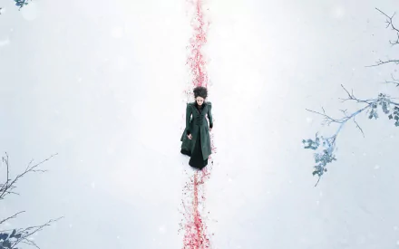 A striking HD wallpaper from the TV show Penny Dreadful, featuring a lone figure in a dark coat walking through a snowy landscape marked by a vivid red trail.
