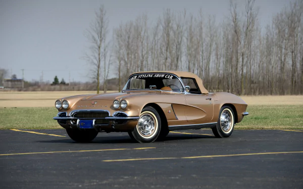 4K Ultra HD PC desktop wallpaper of a tan Chevrolet Corvette (C1) vehicle parked on pavement with bare trees and an open field behind.