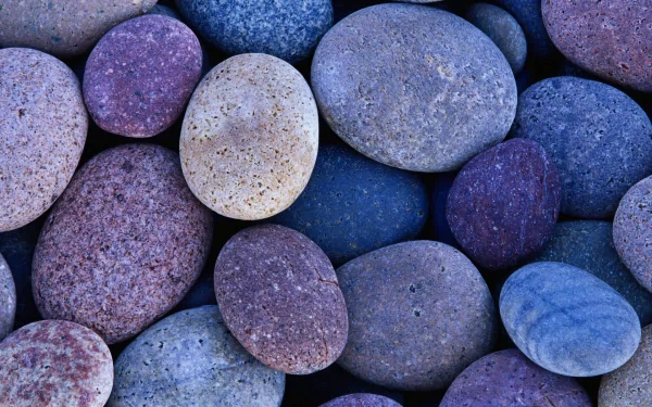 A close-up of smooth, colorful stones in various shades, showcasing the beauty of nature. This HD image serves as a striking desktop wallpaper and background.