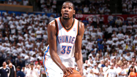 HD wallpaper of a basketball player in action on the court, wearing a white Oklahoma City Thunder jersey with the number 35.