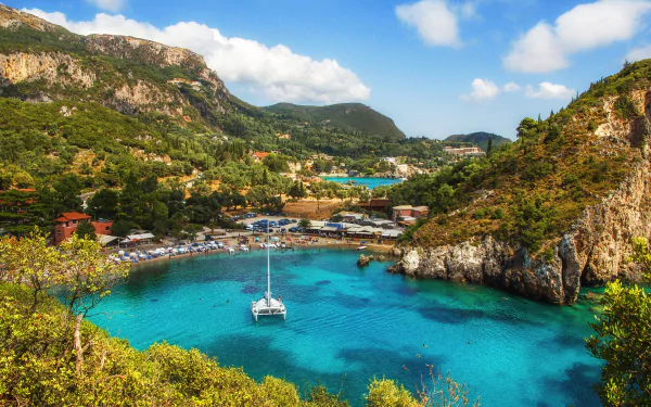 A serene beach scene in Corfu, Greece, featuring a man-made harbor with a boat anchored in vibrant turquoise waters surrounded by lush green hills under a blue sky.