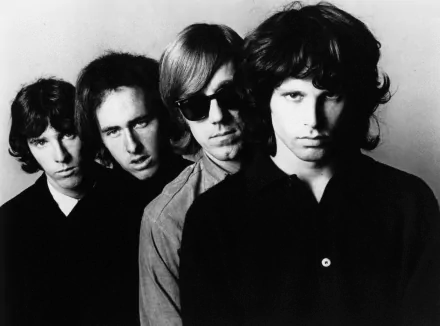 Black and white HD desktop wallpaper featuring The Doors band members Jim Morrison, Ray Manzarek, Robby Krieger, and John Densmore in a close, iconic portrait.