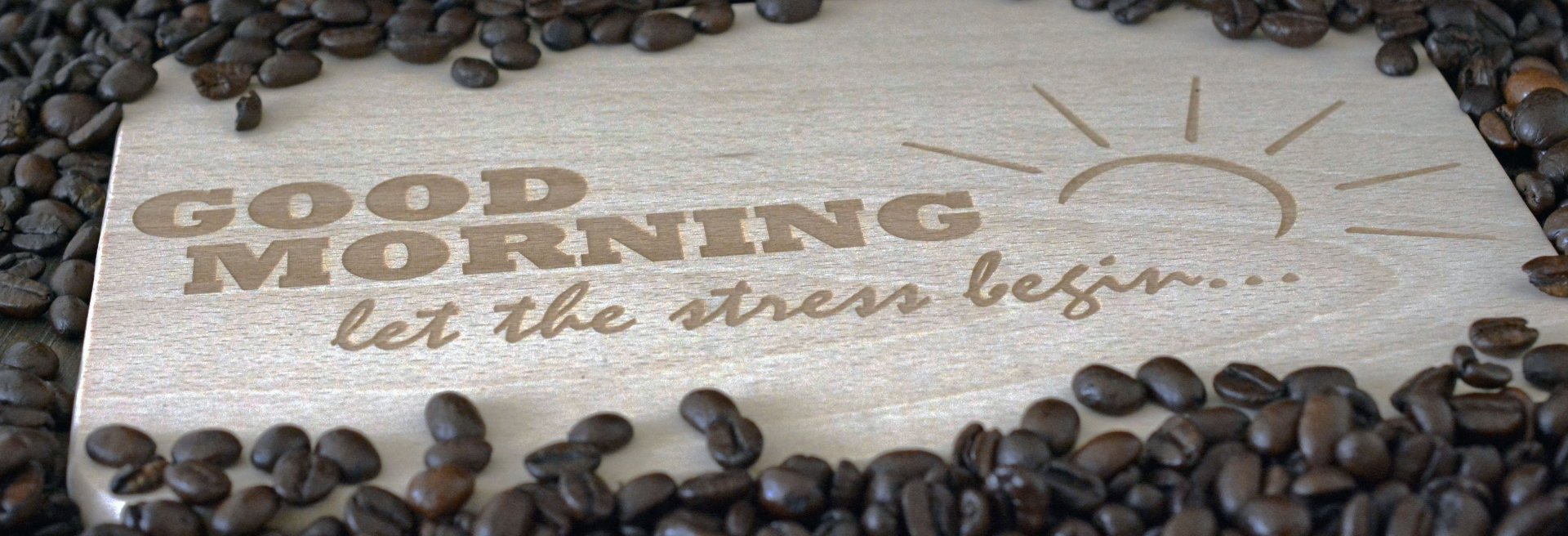 HD PC desktop wallpaper: coffee beans scattered around a wooden sign reading GOOD MORNING — let the stress begin, a playful coffee/food statement for a background.