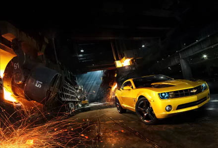 Yellow Chevrolet Camaro SS muscle car showcased in a dark industrial setting with sparks flying, captured in high definition for a PC desktop wallpaper and background.