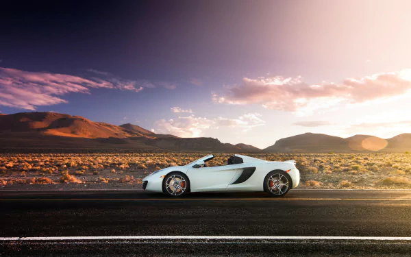 White McLaren MP4-12C Spider supercar parked on a desert road at sunset, captured in a high-definition PC desktop wallpaper background.