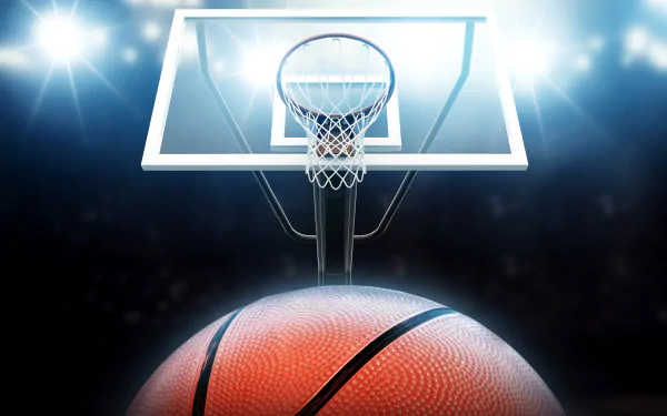 A vibrant 4K Ultra HD image featuring a basketball and hoop, illuminated by dramatic lighting, highlighting the excitement of basketball sports.